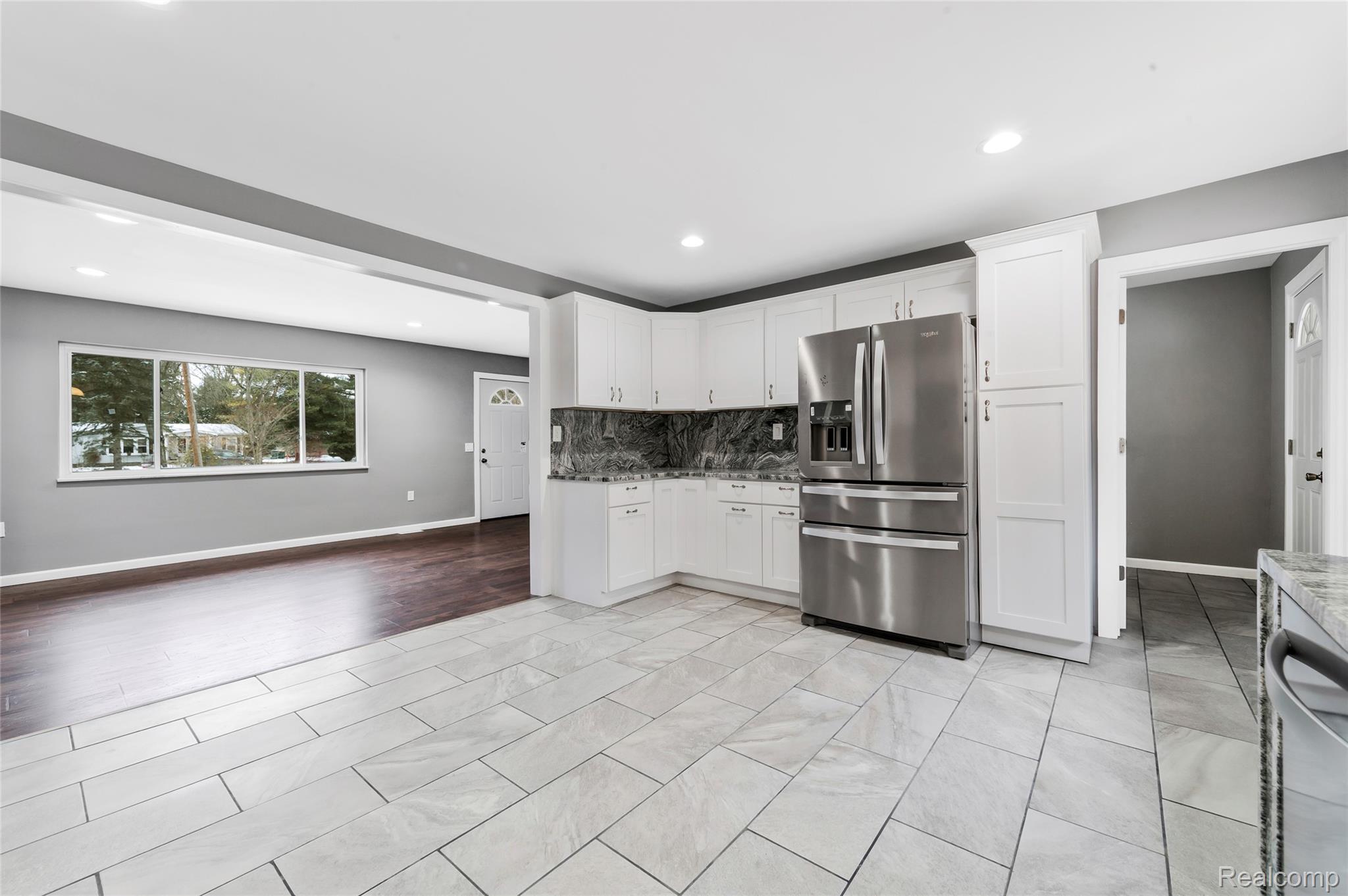 13515 Lenmoore Road Belleville, MI 48111 - Photo 41 of 41 Kitchen featuring stainless steel appliances, white cabinets, tasteful backsplash, recessed lighting, and open floor plan