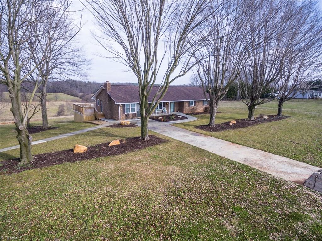 264 Welcome View Church Road Dobson, NC 27017 - Photo 1 of 30 Welcome home to this lovely one-level brick home sitting on 2 acres of land in the heart of the Yadkin Valley Wine Country.