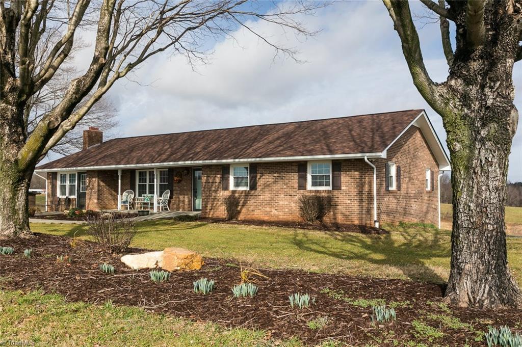264 Welcome View Church Road Dobson, NC 27017 - Photo 2 of 30 Home features nice landscaping, new HVAC, new roof, new windows for efficiency and low maintenance.