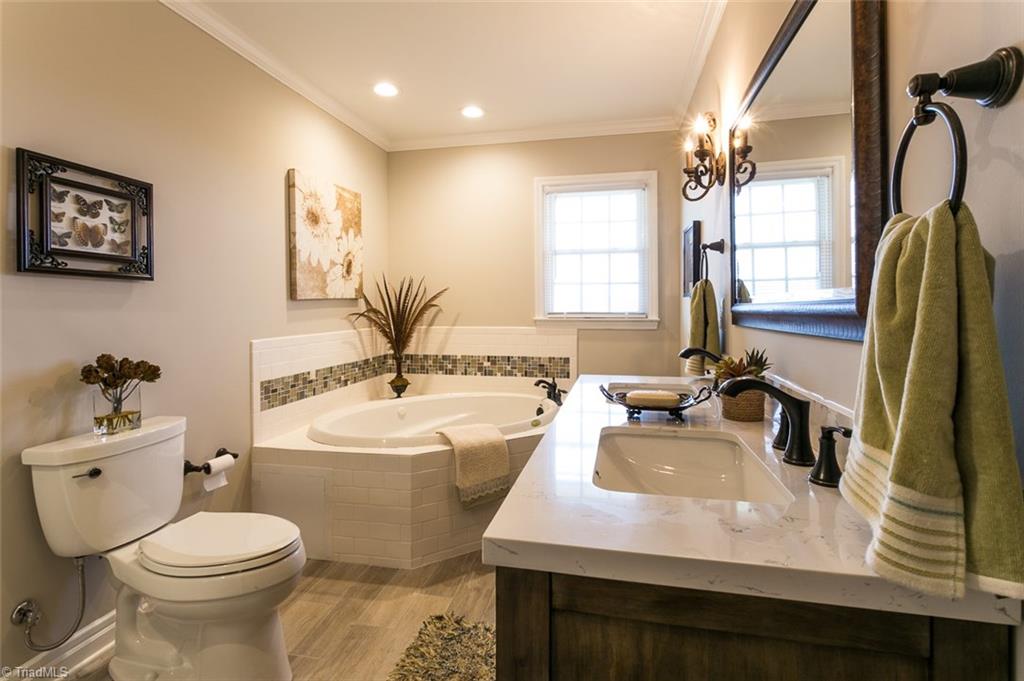 264 Welcome View Church Road Dobson, NC 27017 - Photo 11 of 30 Spacious hall bath with jetted tub and ceramic tile flooring.