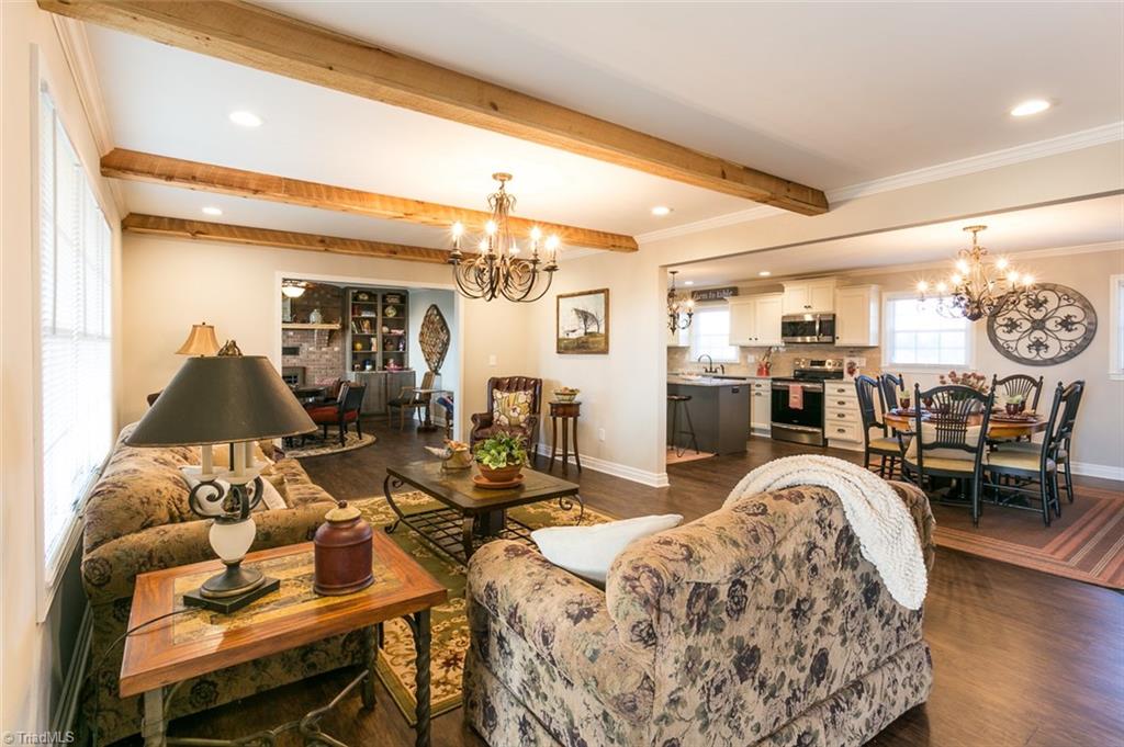 264 Welcome View Church Road Dobson, NC 27017 - Photo 30 of 30 This home has modern farmhouse style with open floor plan and wood beams in living room.