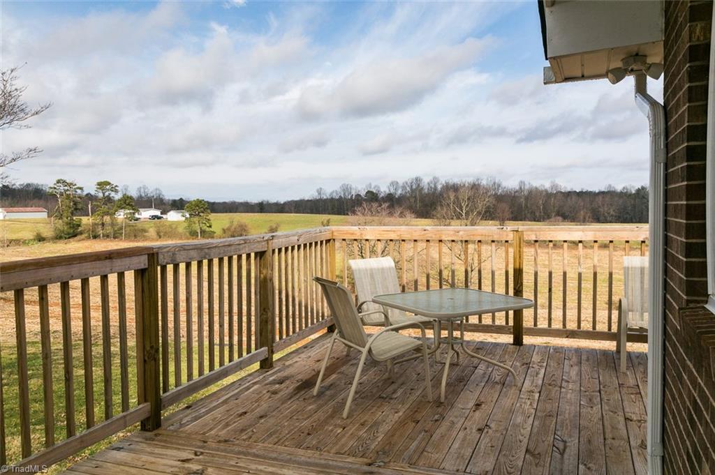 264 Welcome View Church Road Dobson, NC 27017 - Photo 22 of 30 New wrap around deck with countryside views.