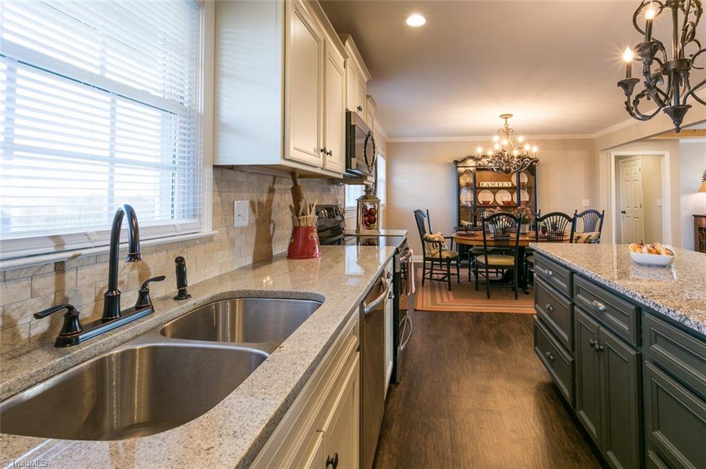 264 Welcome View Church Road Dobson, NC 27017 - Photo 7 of 30 Kitchen features ample work space with plenty of counter top area and cabinets for storage.