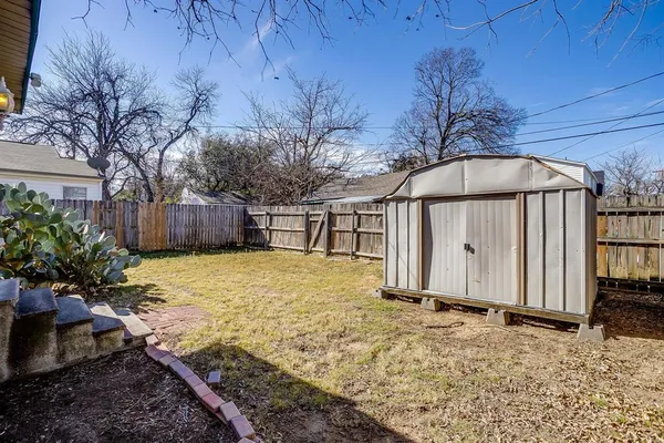 a view of a backyard of the house