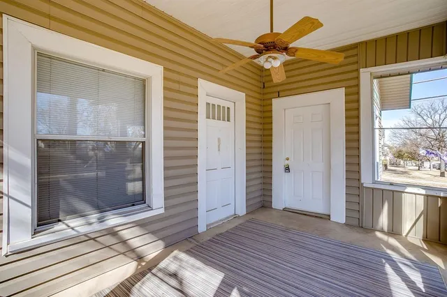 a view of a wooden door and a window