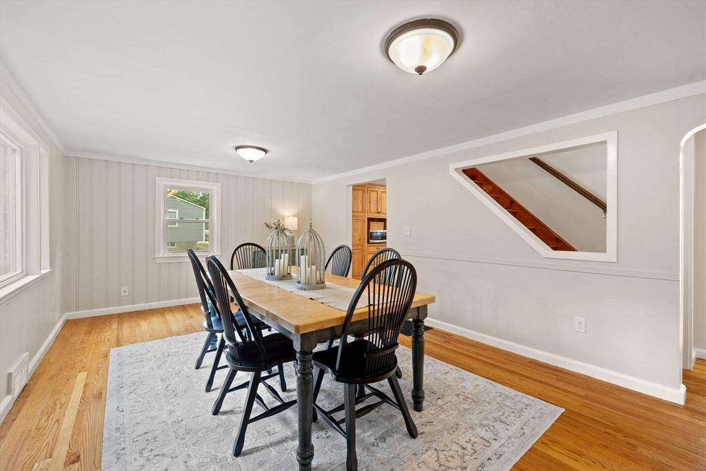 84 New Estate Road Littleton, MA 01460 - Photo 11 of 38 a view of a dining room with furniture and wooden floor