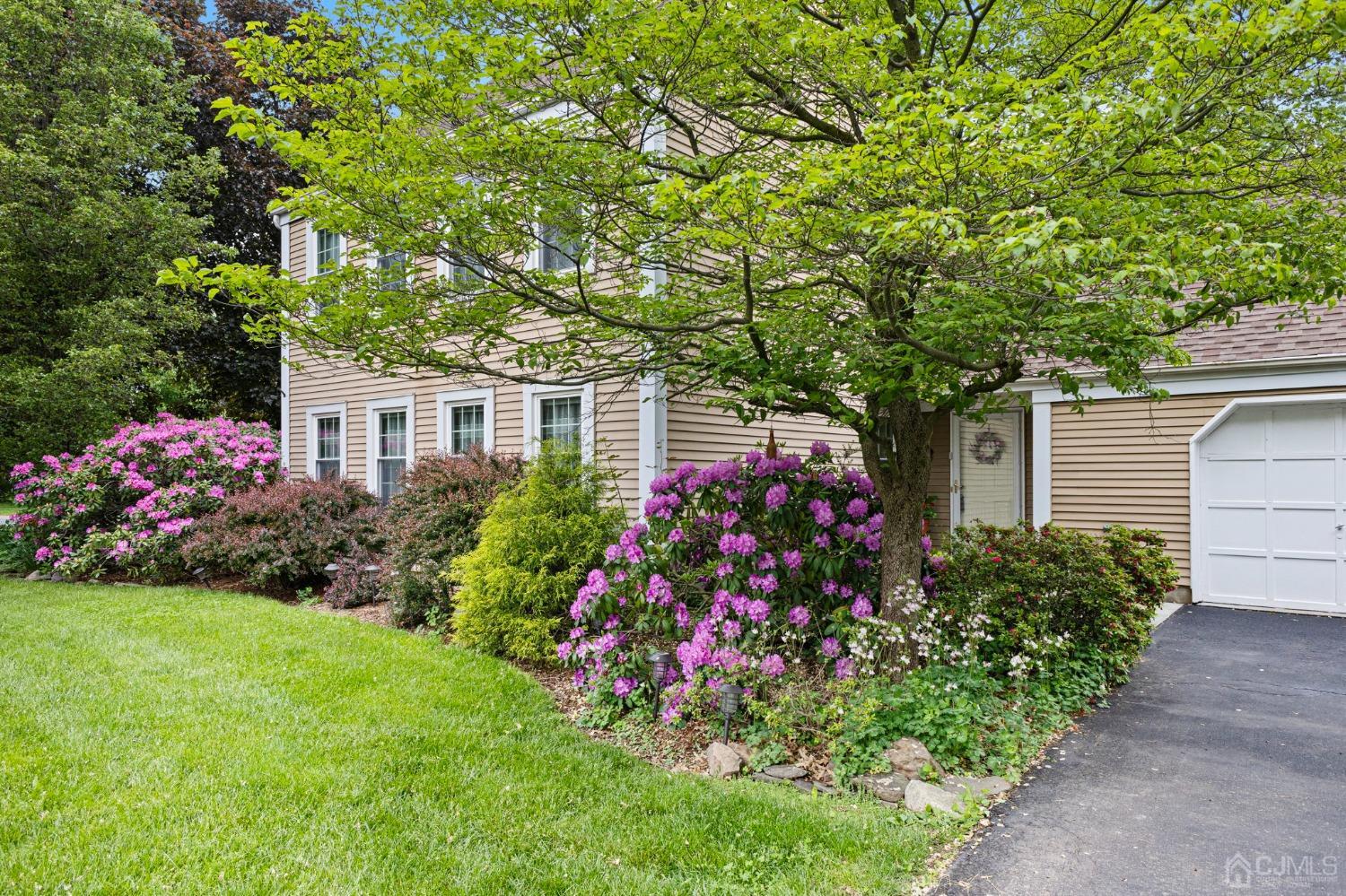 1 Magnolia Road Somerset, NJ 08873 - Photo 3 of 37 a front view of a house with a yard
