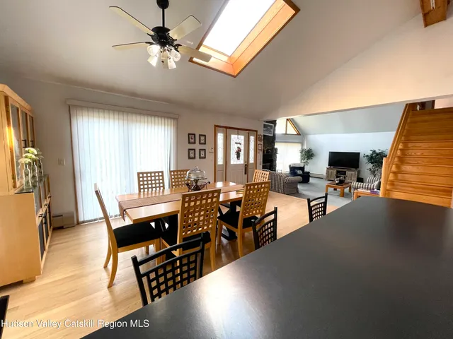 a kitchen with granite countertop a stove a sink dishwasher and a refrigerator