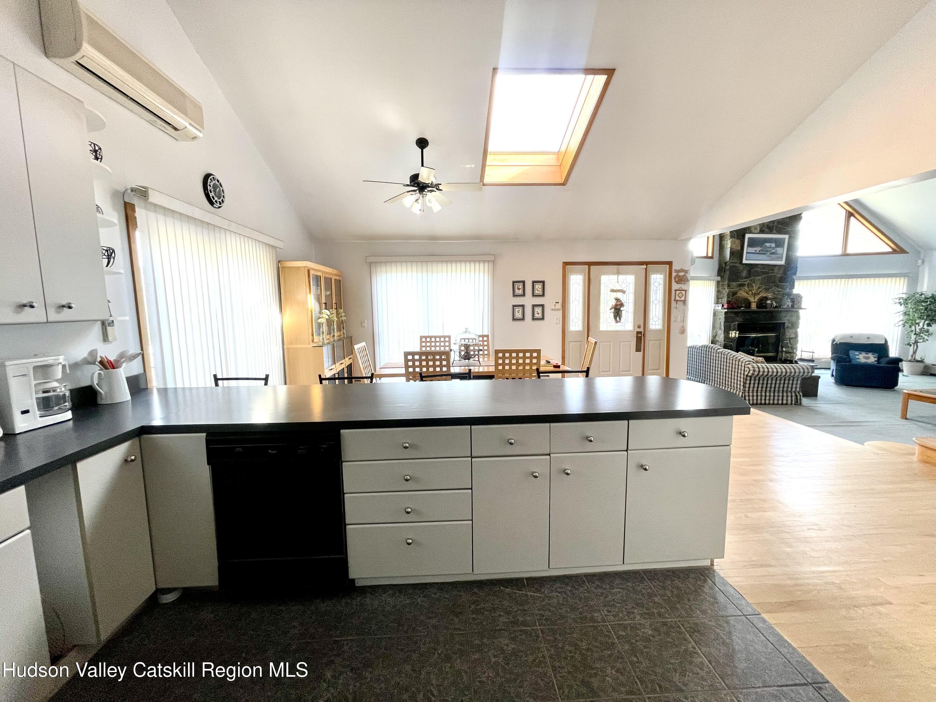 415 Old Road Windham, NY 12496 - Photo 15 of 32 a large kitchen with stainless steel appliances granite countertop a sink and cabinets
