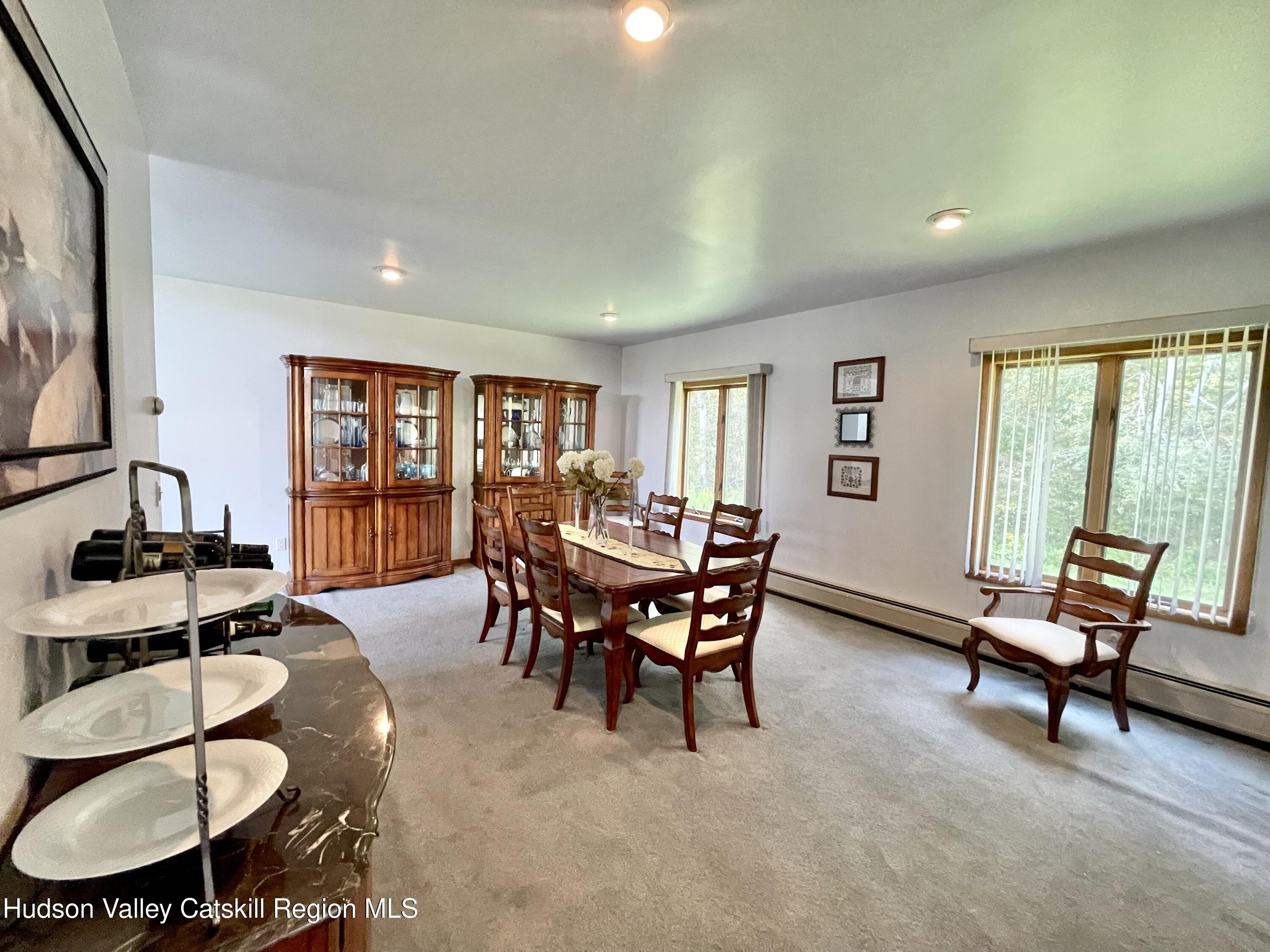 415 Old Road Windham, NY 12496 - Photo 16 of 32 a living room with furniture and a window