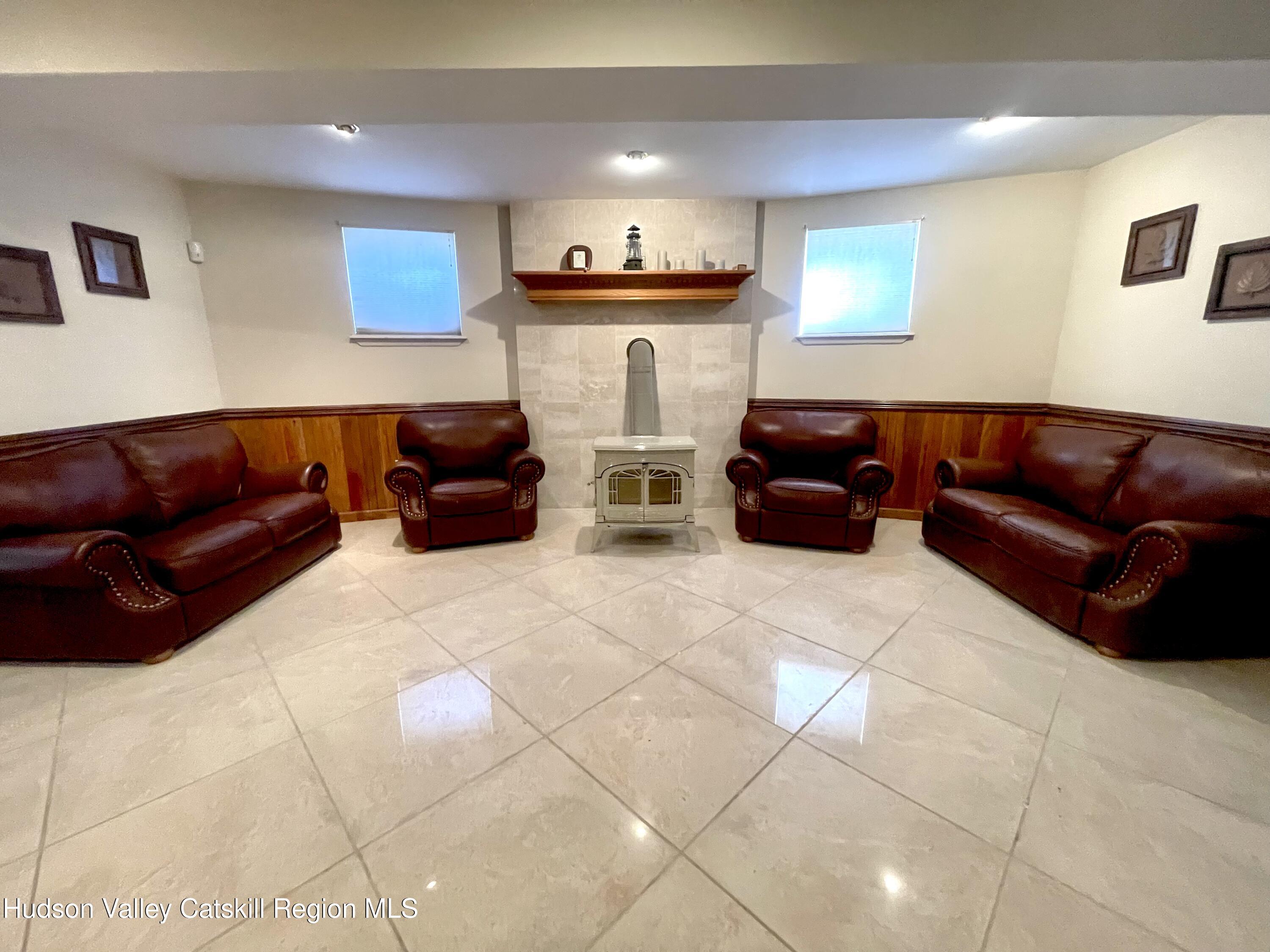 415 Old Road Windham, NY 12496 - Photo 26 of 32 a living room with furniture and a couch