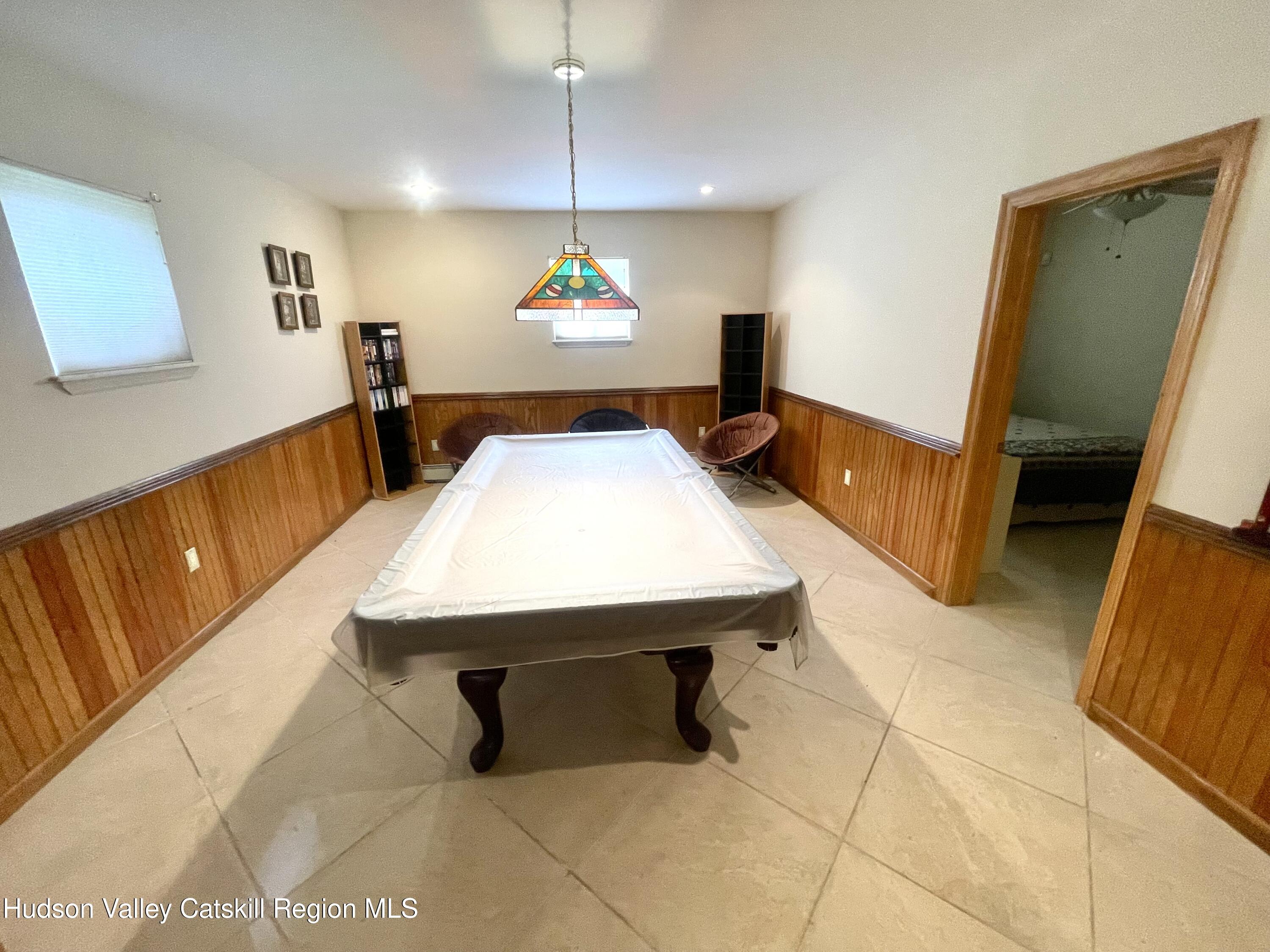 415 Old Road Windham, NY 12496 - Photo 27 of 32 a room with pool table and windows