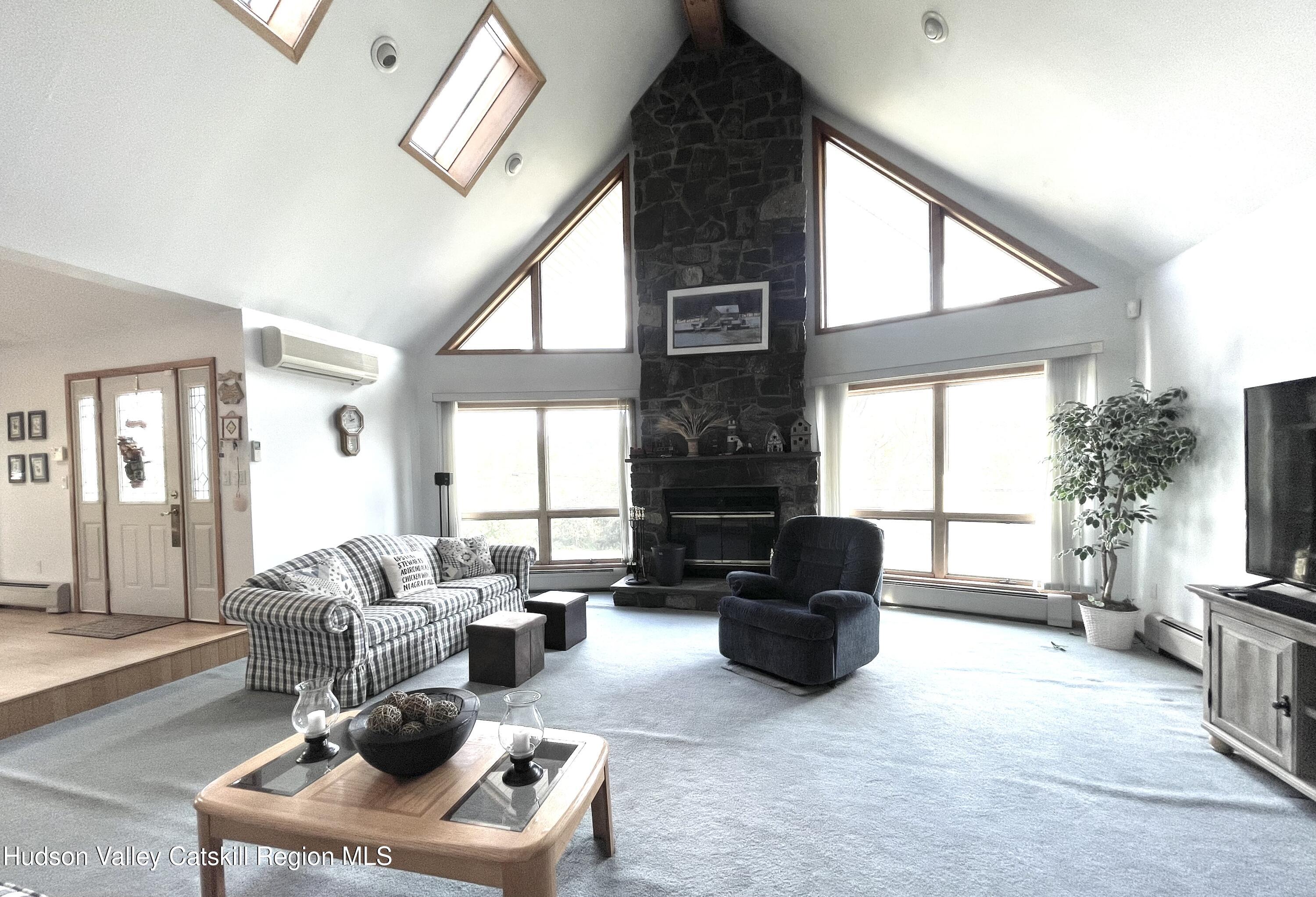 415 Old Road Windham, NY 12496 - Photo 9 of 32 a living room with furniture and a large window
