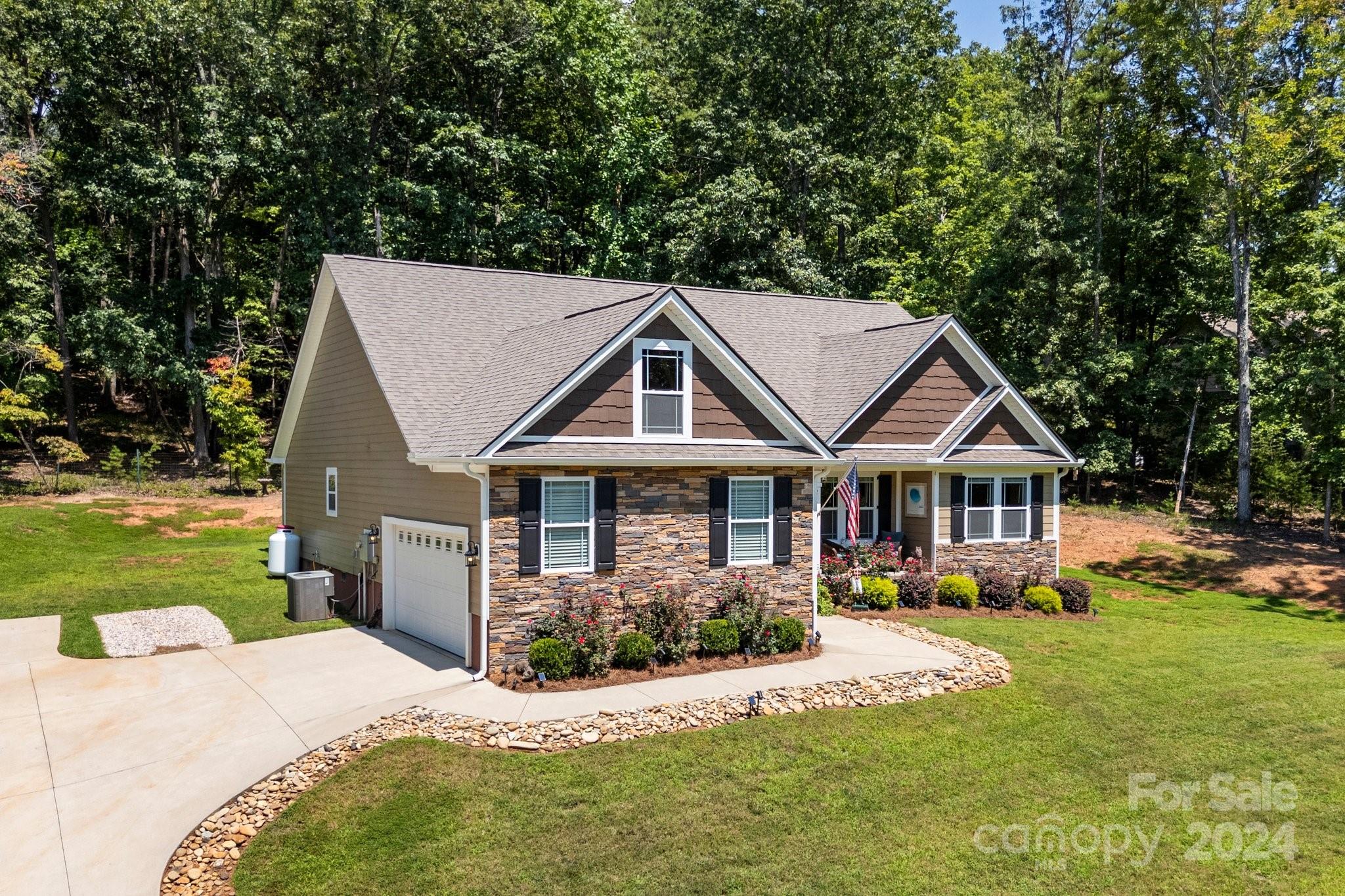 262 Renard Road Tryon, NC 28782 - Photo 1 of 31 a view of a house with a big yard potted plants and large tree