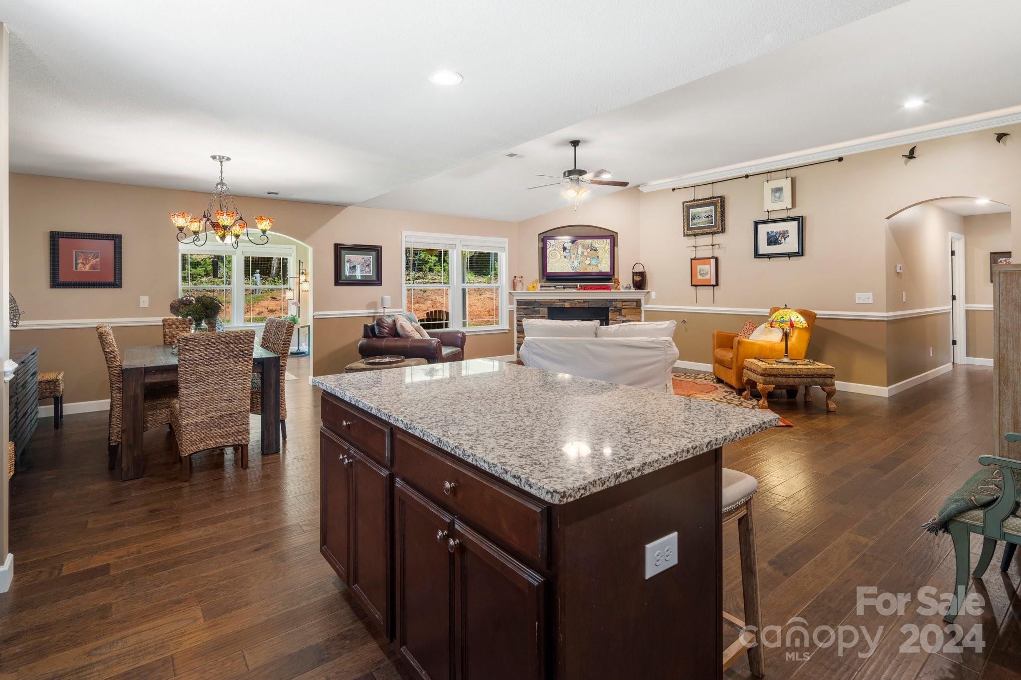 262 Renard Road Tryon, NC 28782 - Photo 12 of 31 a kitchen with a table chairs and wooden floor