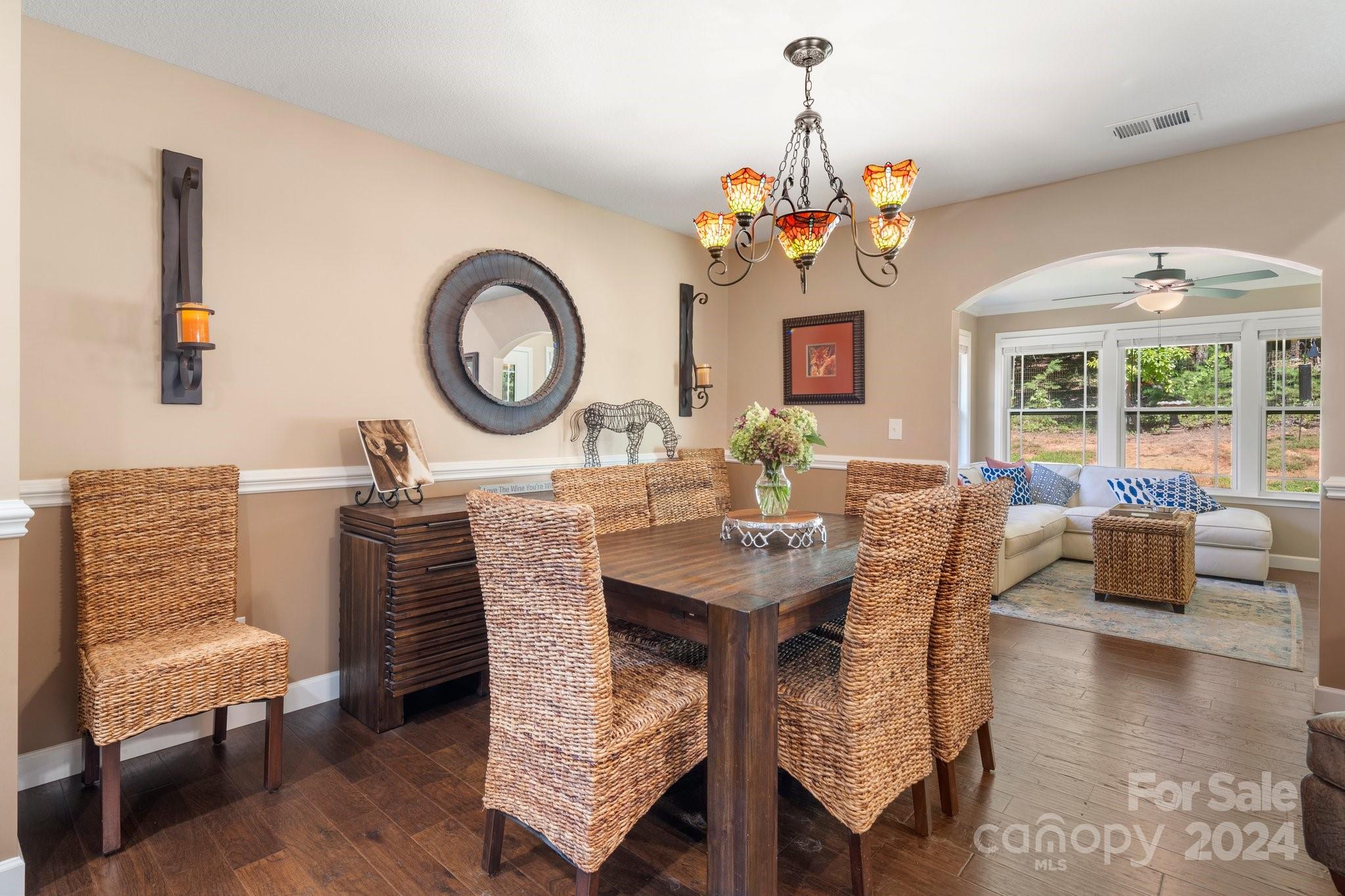262 Renard Road Tryon, NC 28782 - Photo 13 of 31 a dining room with furniture a window and a chandelier