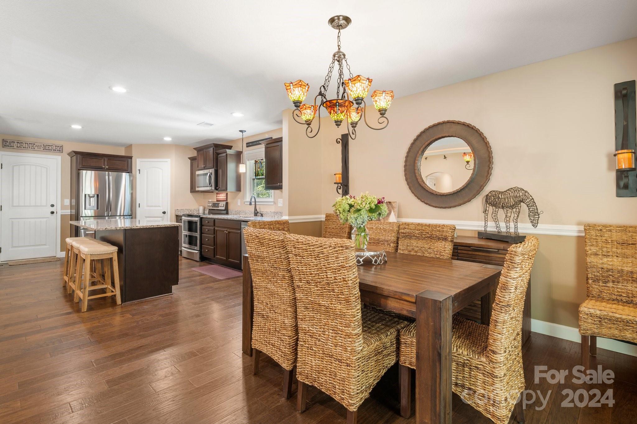 262 Renard Road Tryon, NC 28782 - Photo 15 of 31 a living room with dining table and a kitchen view