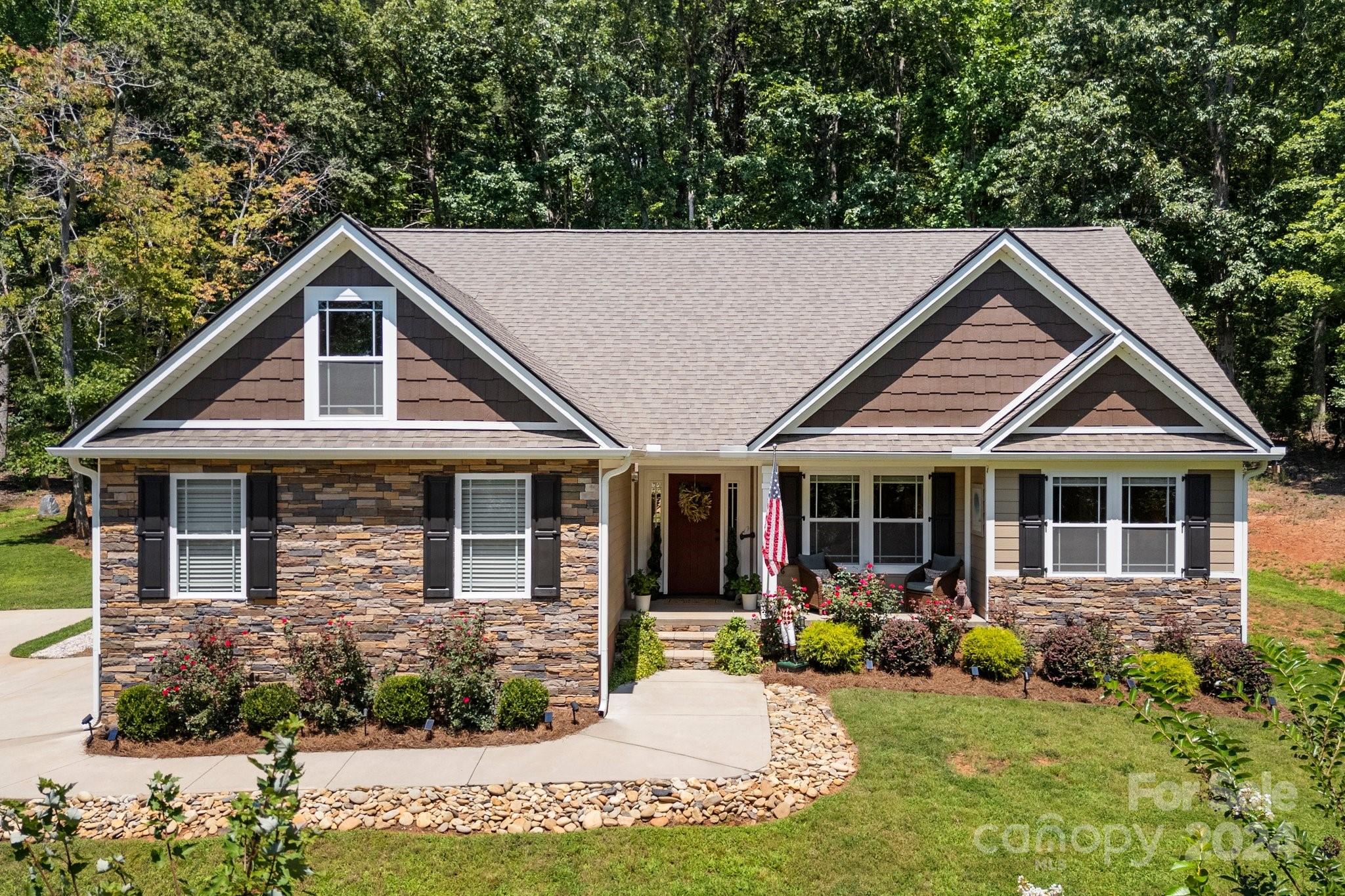 262 Renard Road Tryon, NC 28782 - Photo 2 of 31 a view of a house with yard and sitting area