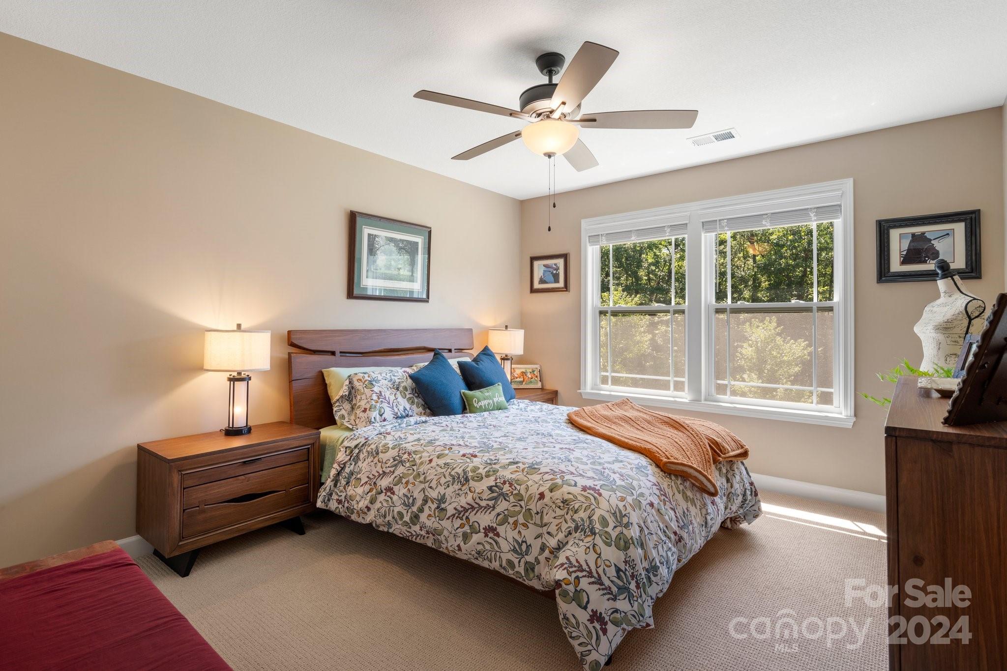 262 Renard Road Tryon, NC 28782 - Photo 22 of 31 a bedroom with a bed dresser and a window