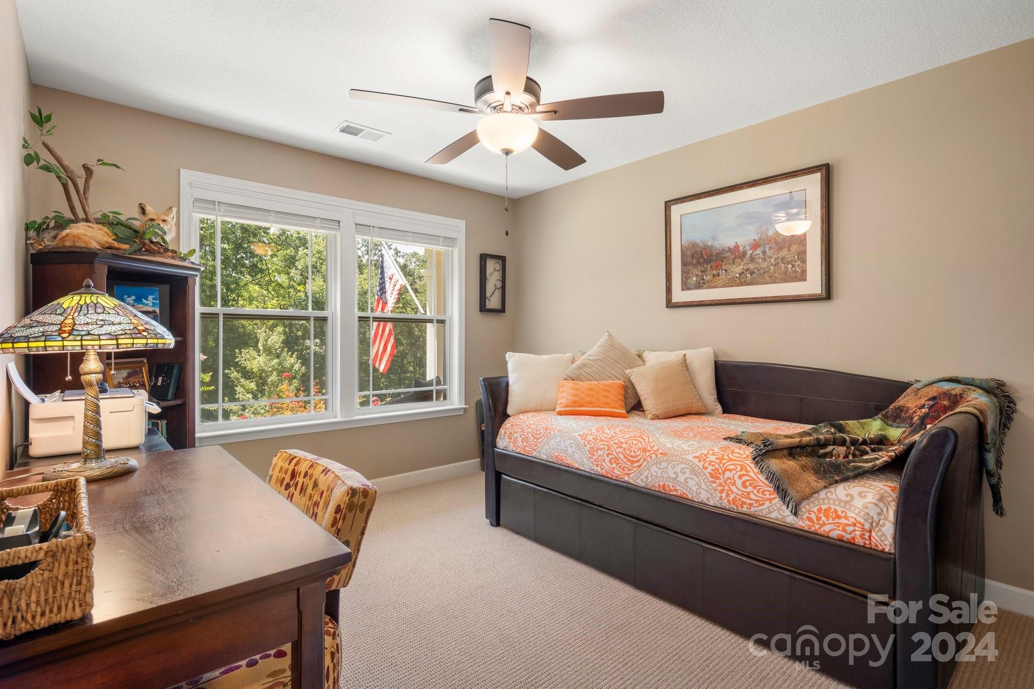262 Renard Road Tryon, NC 28782 - Photo 24 of 31 a bed room with a bed window and a table