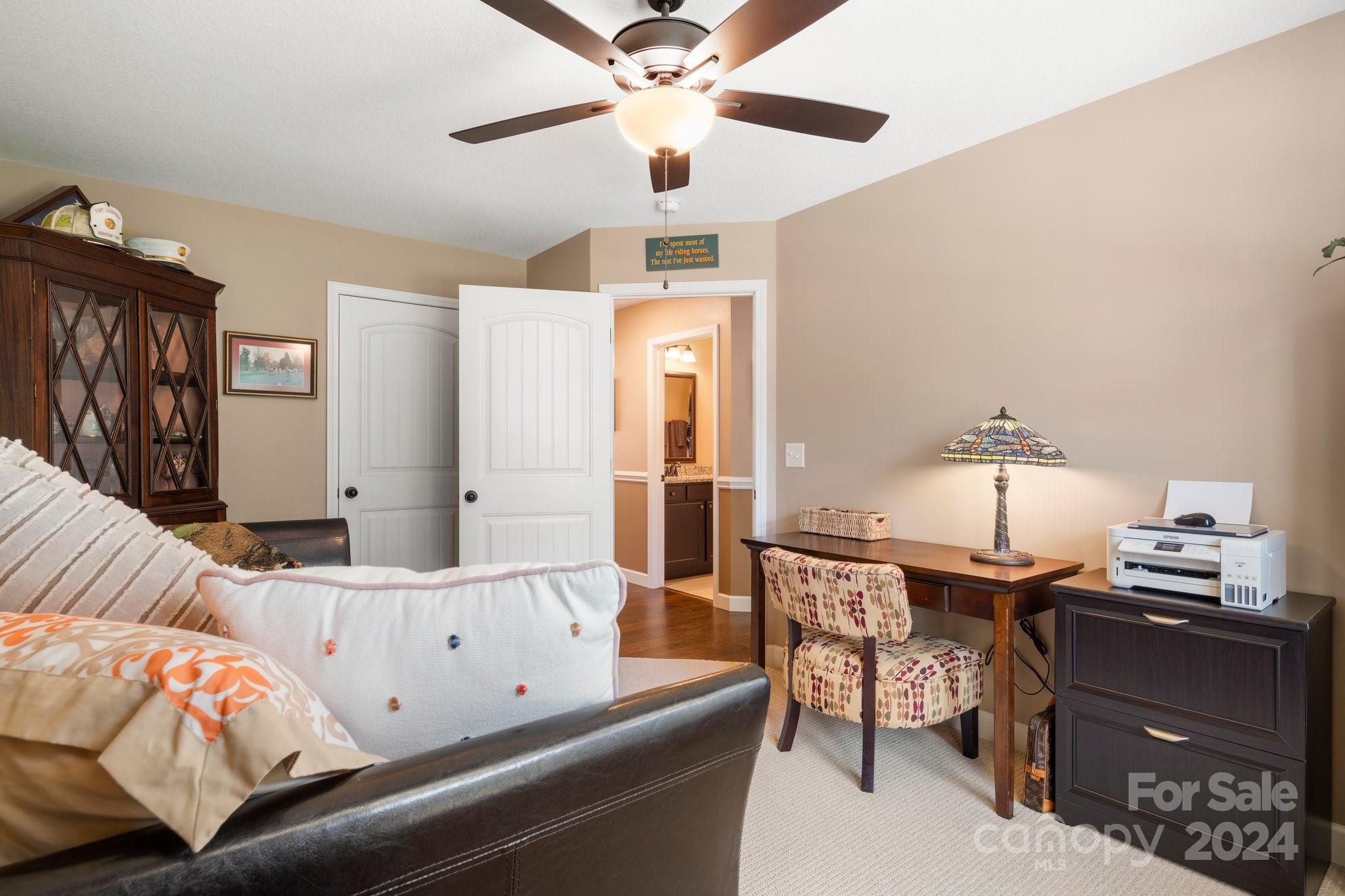 262 Renard Road Tryon, NC 28782 - Photo 25 of 31 a living room with furniture and a chandelier