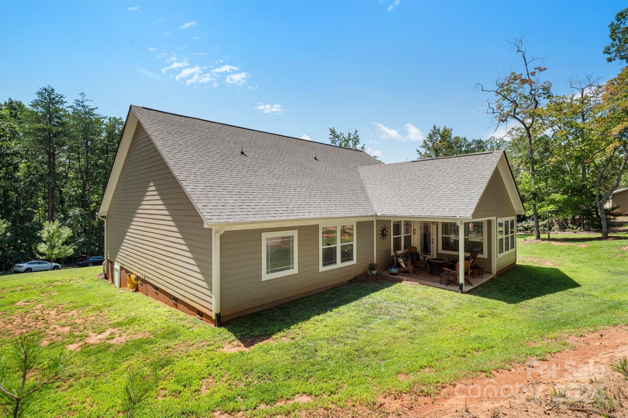 262 Renard Road Tryon, NC 28782 - Photo 30 of 31 a view of a house with a yard