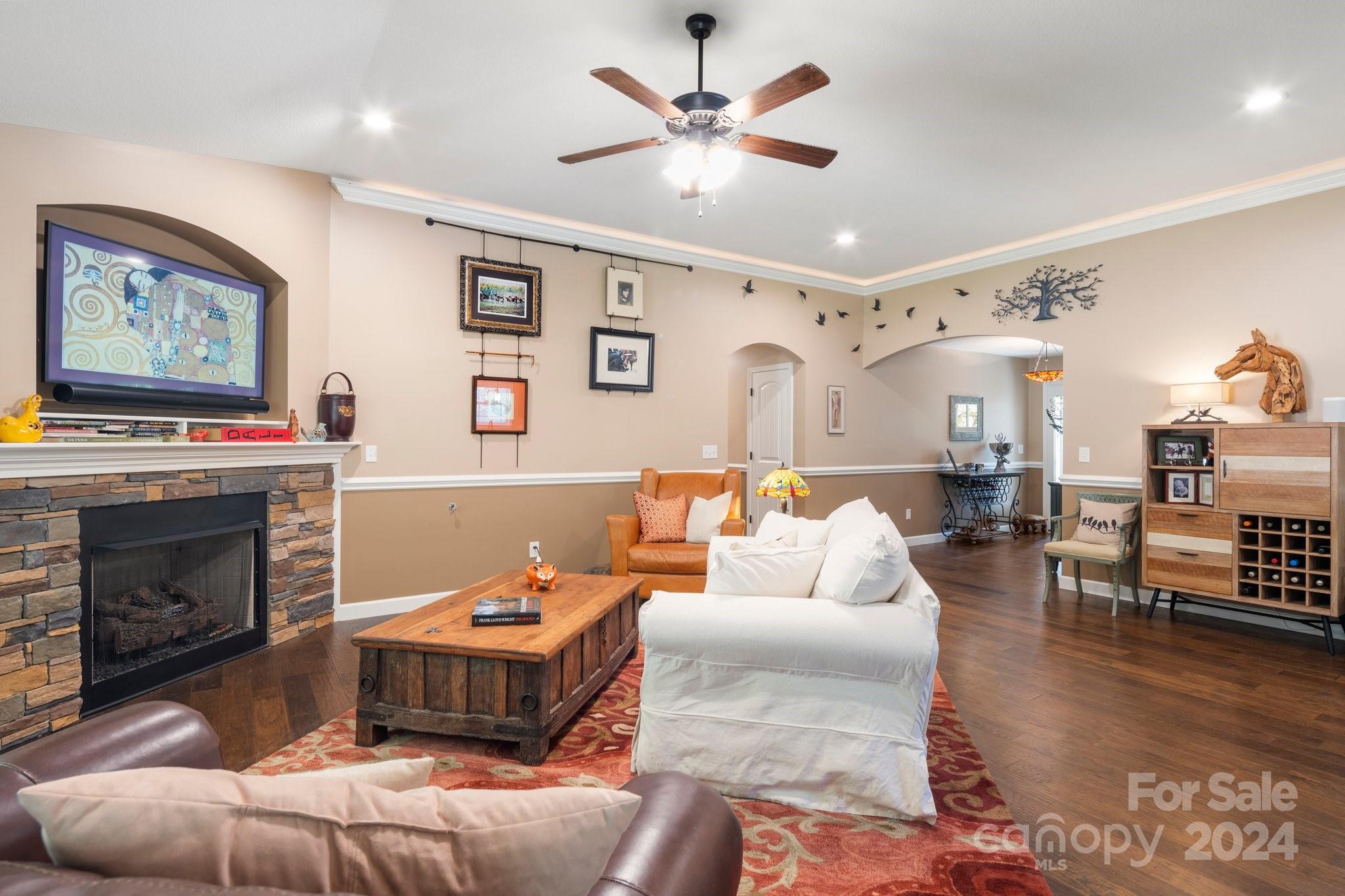 262 Renard Road Tryon, NC 28782 - Photo 6 of 31 a living room with furniture a fireplace and wooden floor
