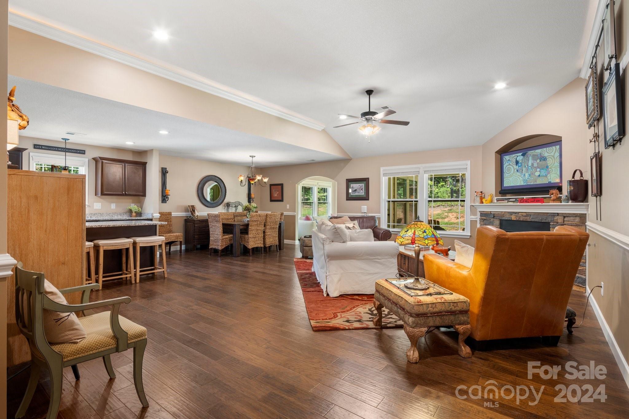 262 Renard Road Tryon, NC 28782 - Photo 7 of 31 a living room with furniture dining table a rug and kitchen view