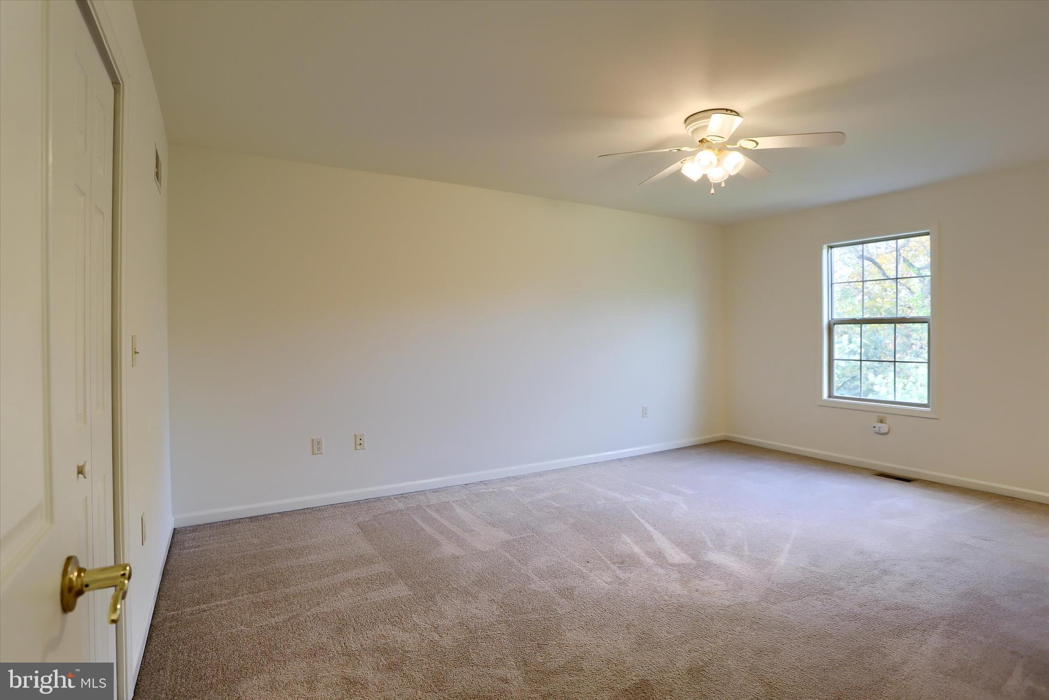 221 West Locust Street Enola, PA 17025 - Photo 28 of 46 an empty room with windows and chandelier fan