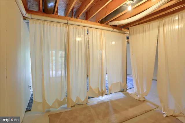 a bathroom with a shower and a glass door