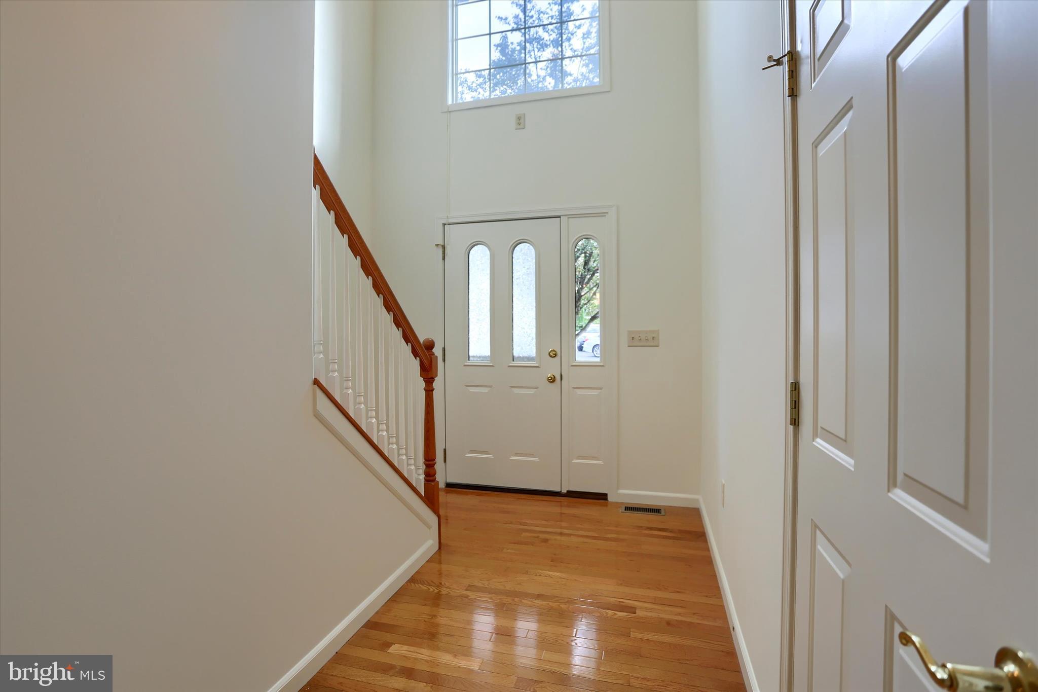 221 West Locust Street Enola, PA 17025 - Photo 6 of 46 a view of a hallway with wooden floor and entryway