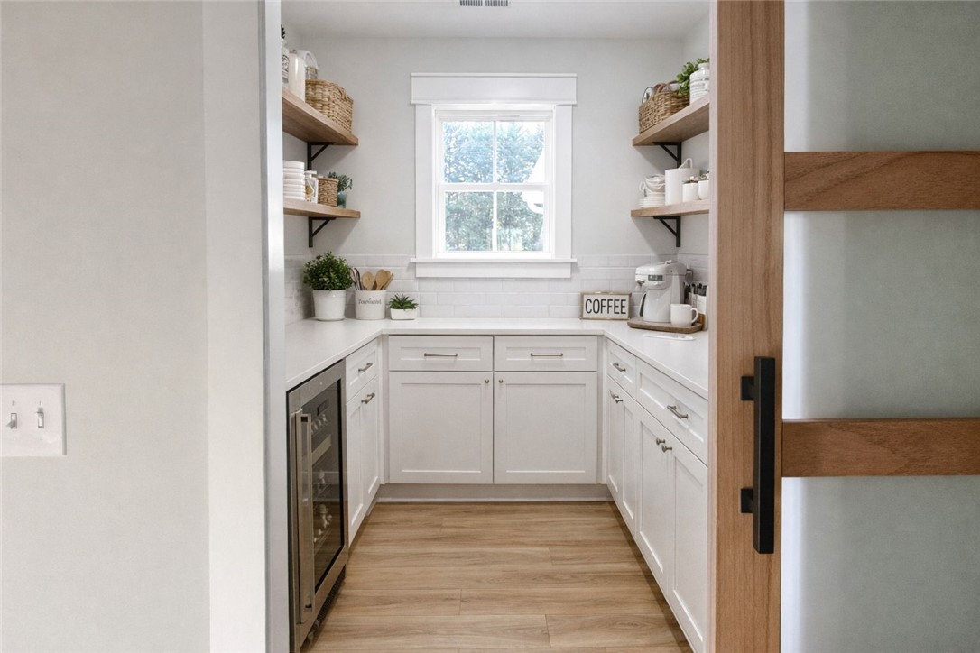 2515 Highway 29 Anderson, SC 29621 - Photo 16 of 38 A well-organized pantry features open shelving, ample counter space, and a dedicated beverage cooler for seamless entertaining.
