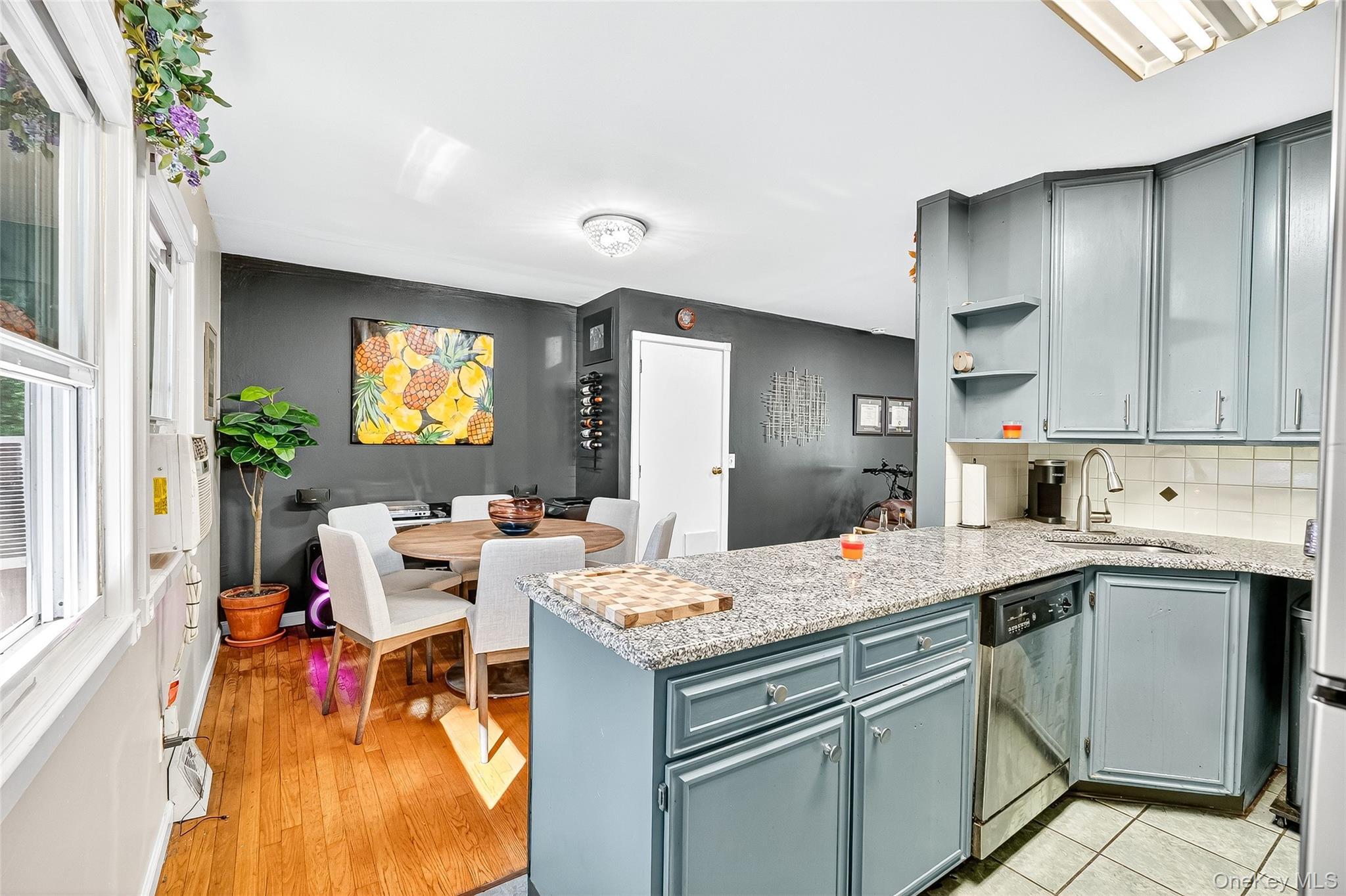 512 High Street Monroe, NY 10950 - Photo 18 of 18 a open kitchen with a stove a sink dishwasher and a dining table with garden view