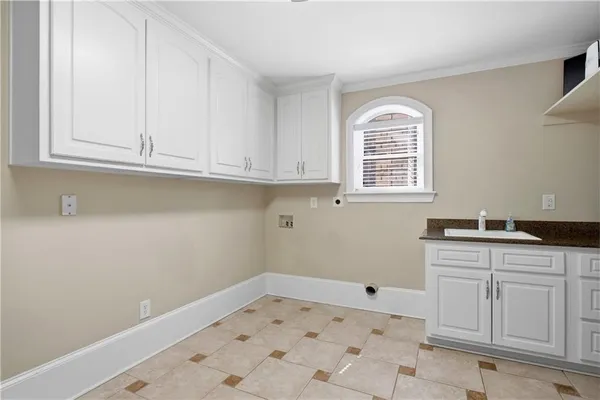a bathroom with a sink and cabinets