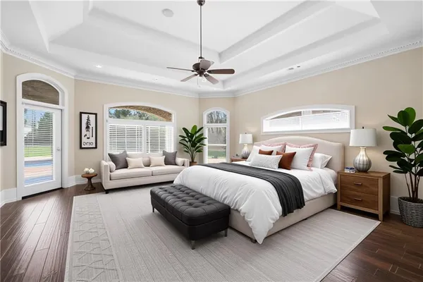 a spacious bedroom with a bed and a couch