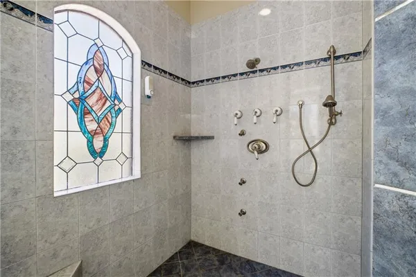 a bathroom with a shower and a sink