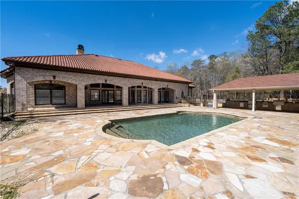 a view of a house with a swimming pool