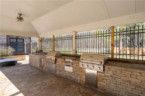 a kitchen with stainless steel appliances granite countertop a stove a sink and a refrigerator