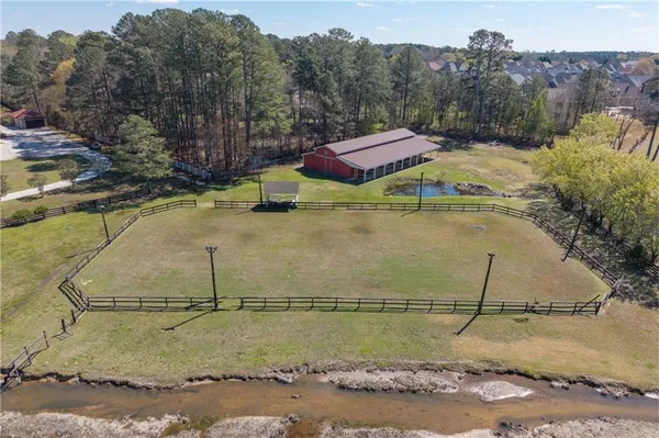 a view of a swimming pool with a yard