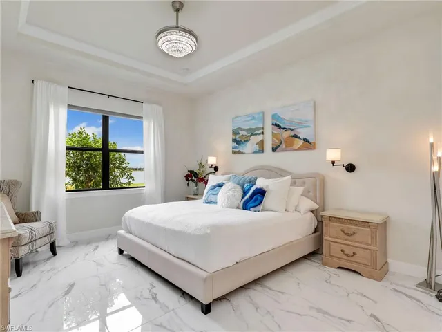 a large kitchen with stainless steel appliances granite countertop a lot of counter space and wooden floors