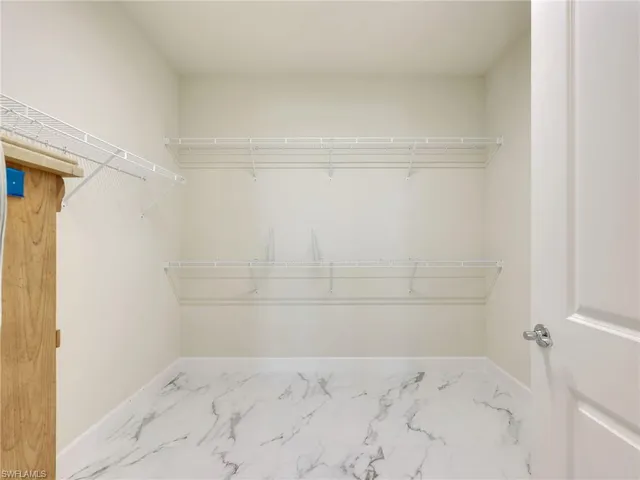 a bathroom with a double vanity sink mirror and shower