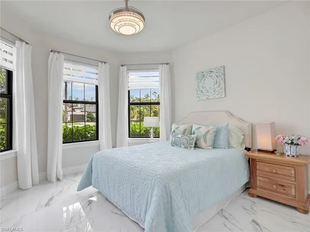 a room with a table a mirror and a shower