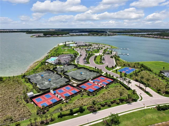 an aerial view of house with yard swimming pool and outdoor seating
