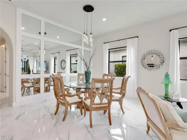 a view of kitchen with dining table and chairs