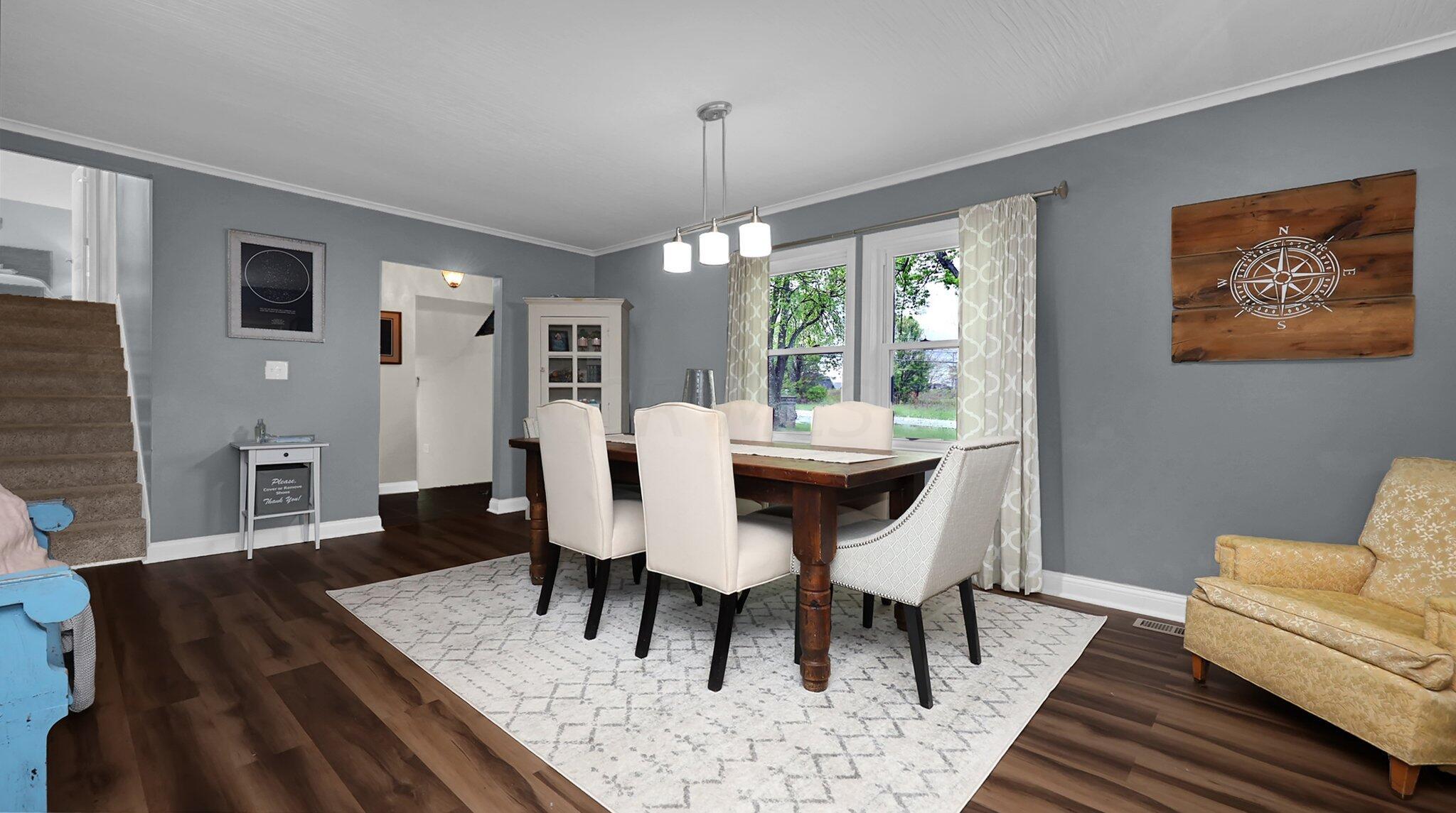 7790 Schott Road Westerville, OH 43081 - Photo 7 of 50 Upon entry, you'll be welcome into the beautiful dining room with LVP flooring, upgraded light fixture and space to host the biggest of family events!