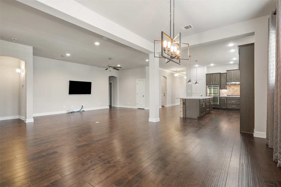 103 Lockhart Loop Georgetown, TX 78628 - Photo 16 of 40 a view of a kitchen and a chandelier