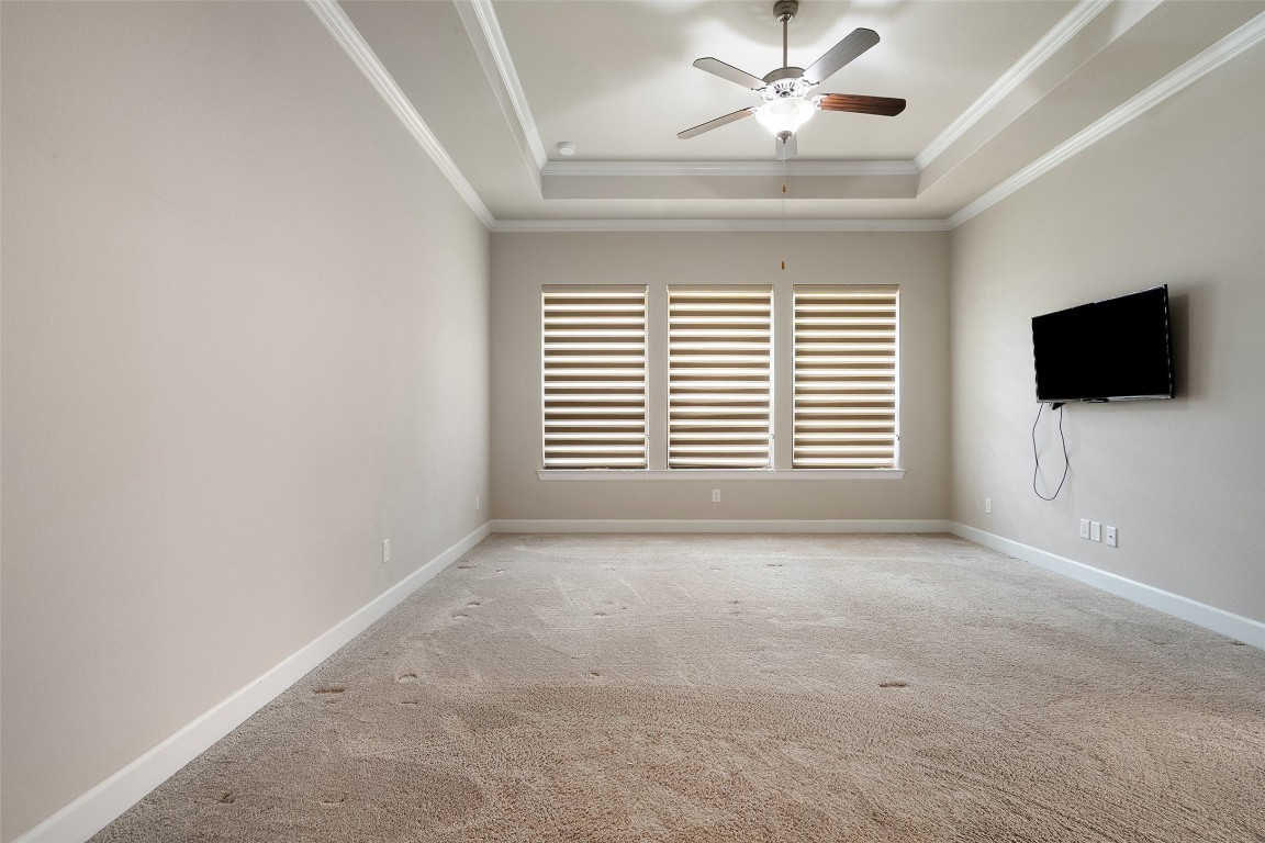 103 Lockhart Loop Georgetown, TX 78628 - Photo 26 of 40 a view of an empty room with a window and a flat screen tv