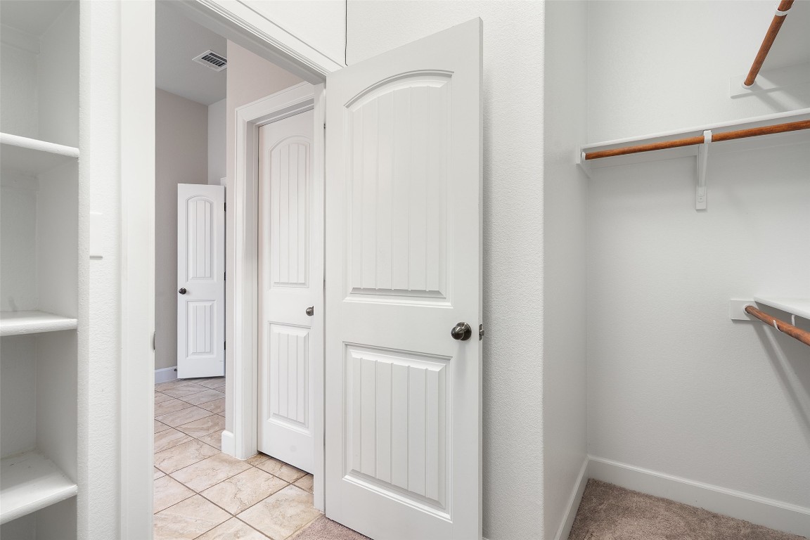 103 Lockhart Loop Georgetown, TX 78628 - Photo 32 of 40 a view of a bathroom from a hallway