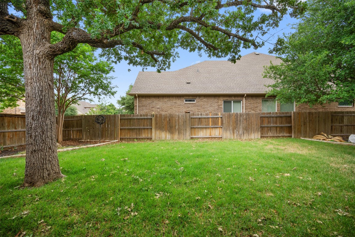 103 Lockhart Loop Georgetown, TX 78628 - Photo 39 of 40 a house view with a garden space