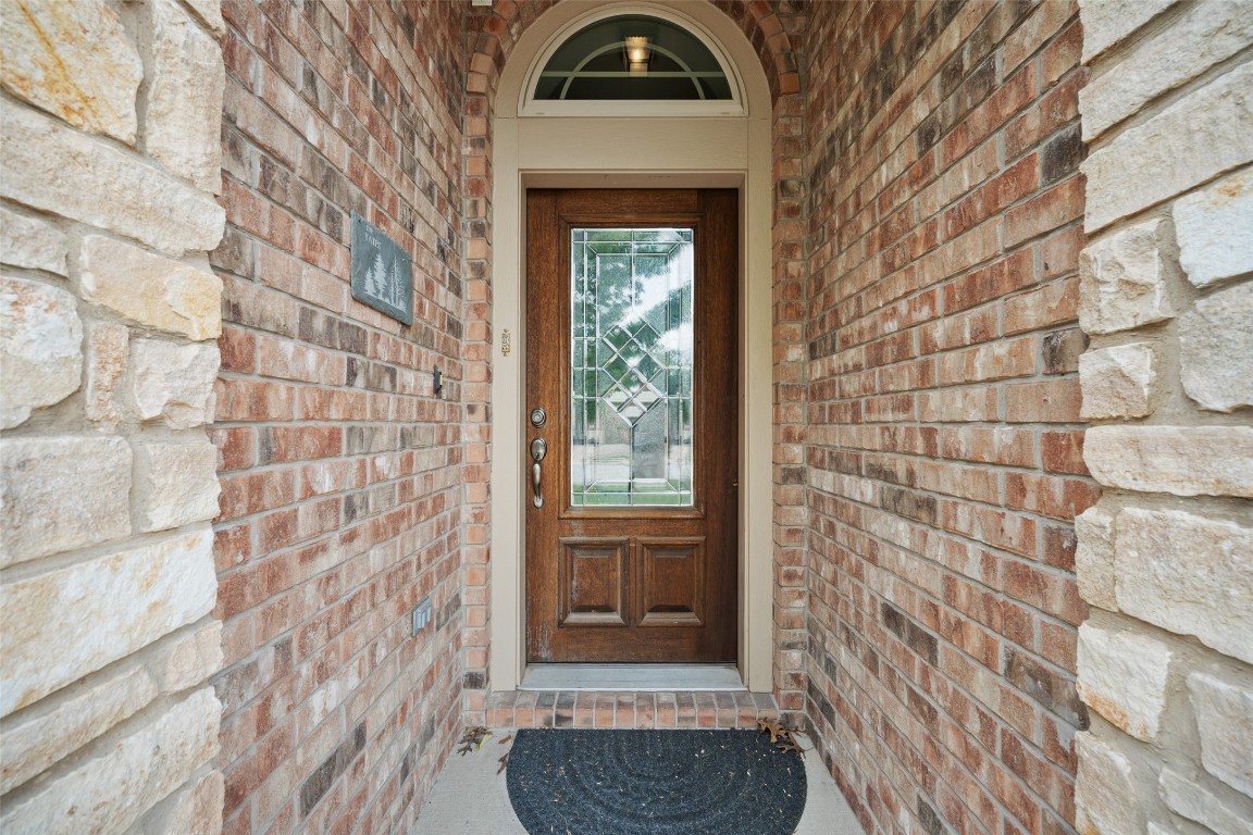 103 Lockhart Loop Georgetown, TX 78628 - Photo 6 of 40 Doorway to property featuring brick siding